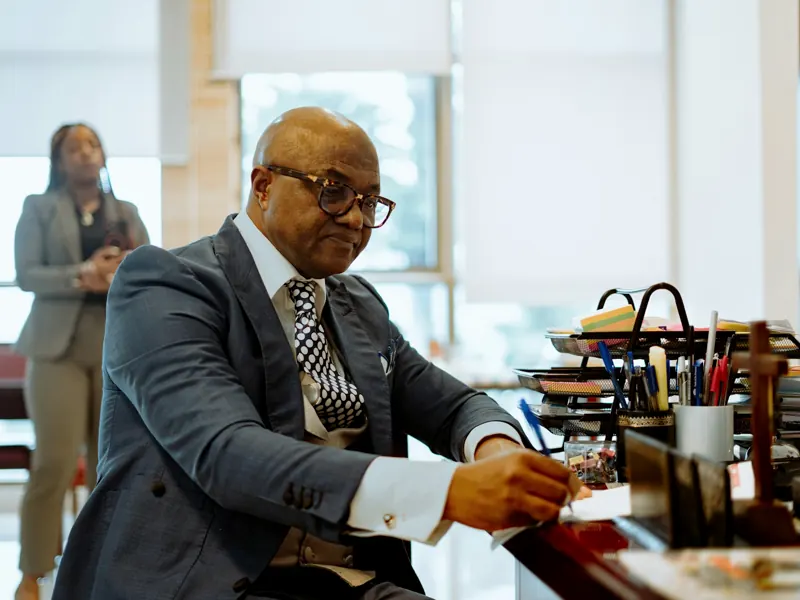 Lawyer reviewing documents at his desk